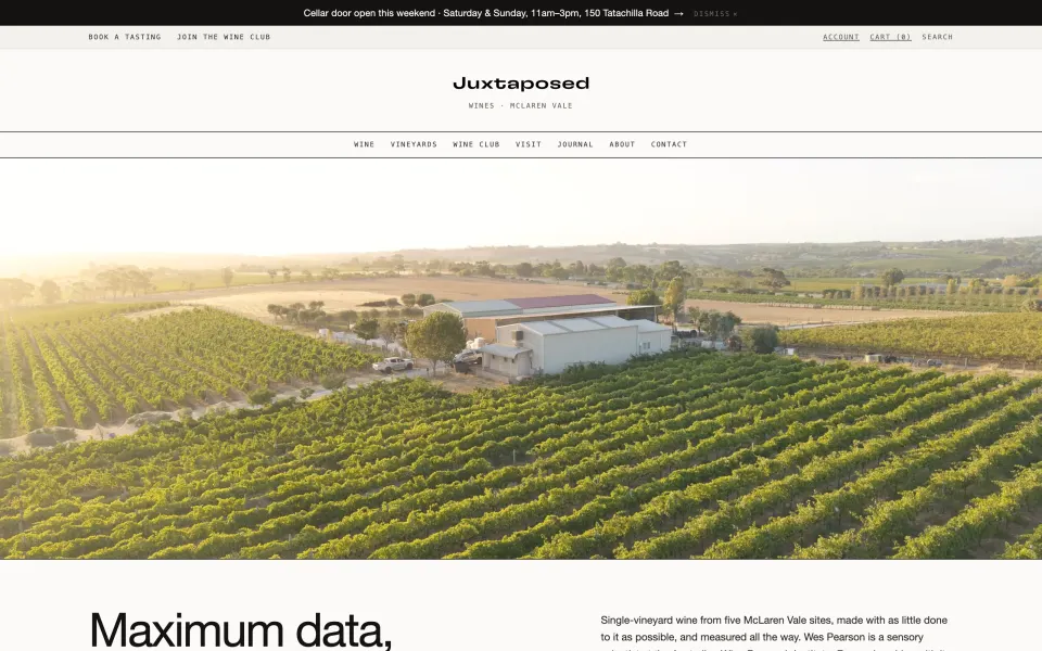 The Juxtaposed Wines homepage: a centred logotype above an aerial photograph of the McLaren Vale vineyard at sunset